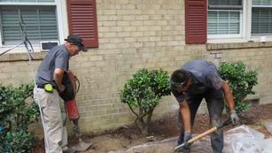 Crew digging and grading front yard.