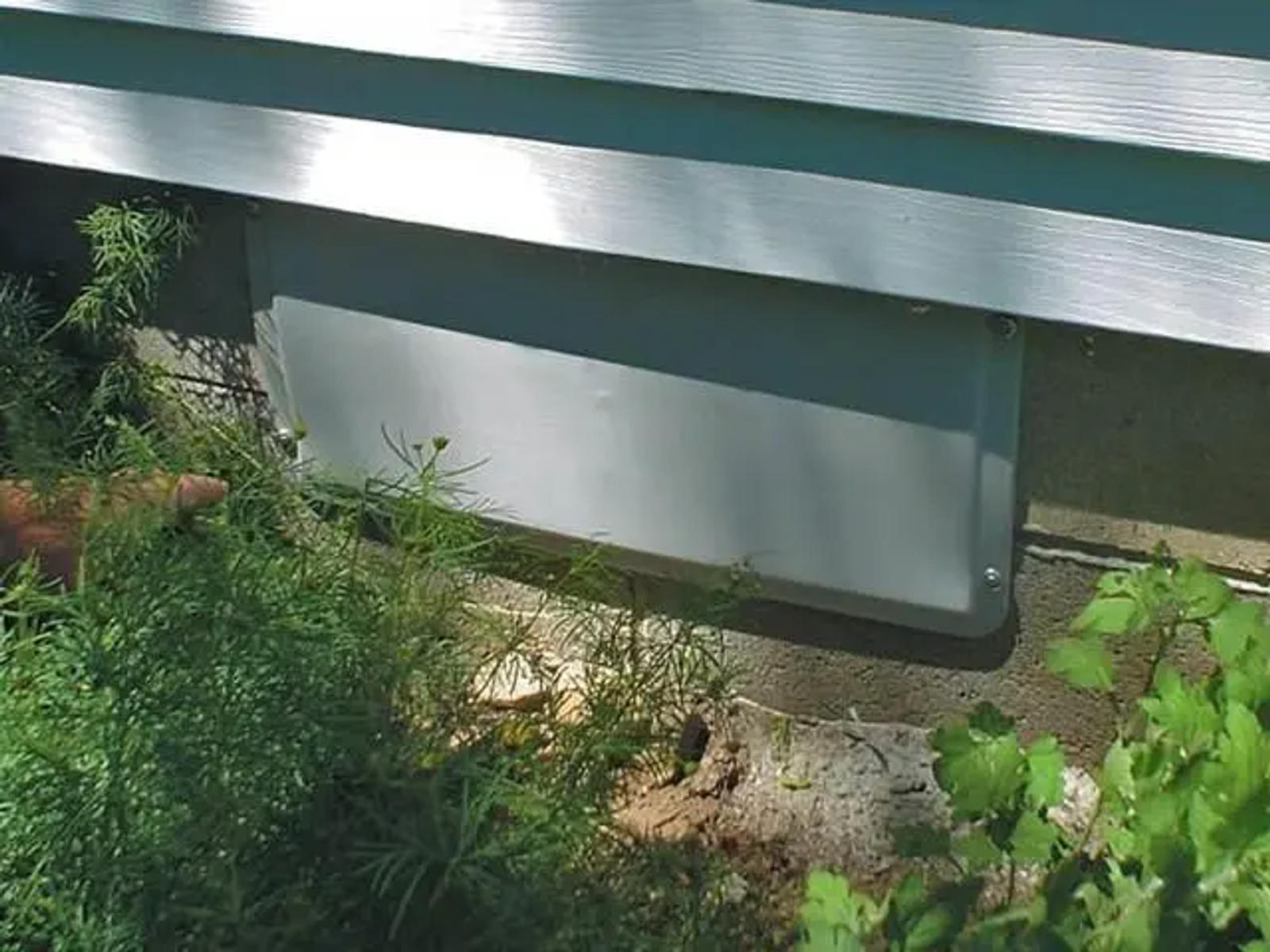 The exterior of a crawlspace vent cover.