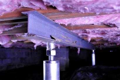Intellijack installed on I-beam in crawl space with insulation