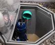 looking inside an open sump pit
