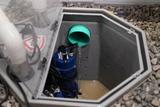 looking inside an open sump pit