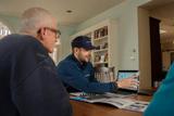 inspector reviewing documents with homeowners