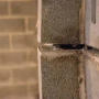 Cinderblock bowing wall with gap.