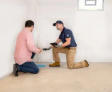 Groundworks Expert explains to home owner the solution installed in their basement
