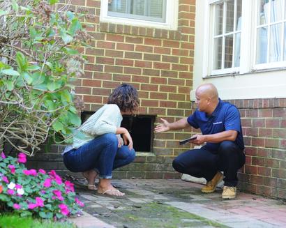 CFI is showing the homeowner the open crawlspace.