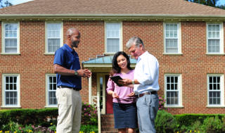 CFI discussion with customers in the front yard.