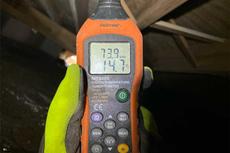 Moisture meter test in crawlspace.