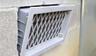 Close-up of open crawlspace vent.