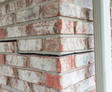 stairstep crack in brick on corner of home