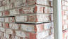 stairstep crack in brick on corner of home