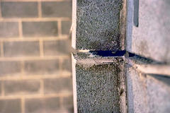 Gap between cinderblock foundation wall.