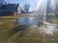 Yard flooded with standing water.