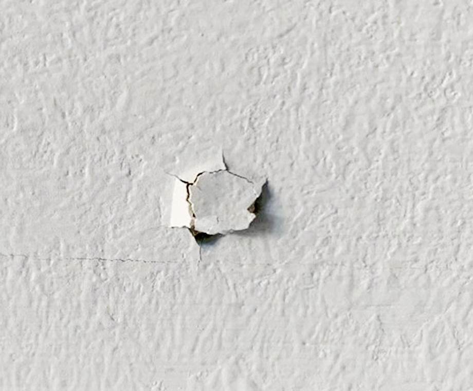 Nail pop in drywall.