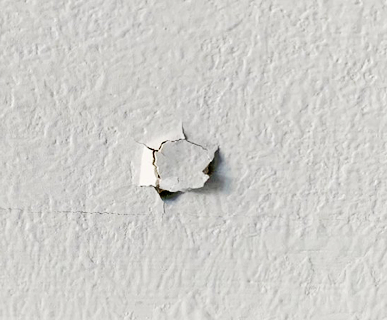 Nail pop in drywall.