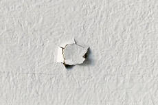 Nail pop in drywall.