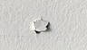Nail pop in drywall.