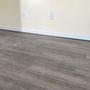 Uneven wood floors with laser level on basebaord