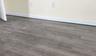 Uneven wood floors with laser level on basebaord