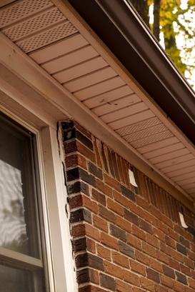 window separating from brick on home