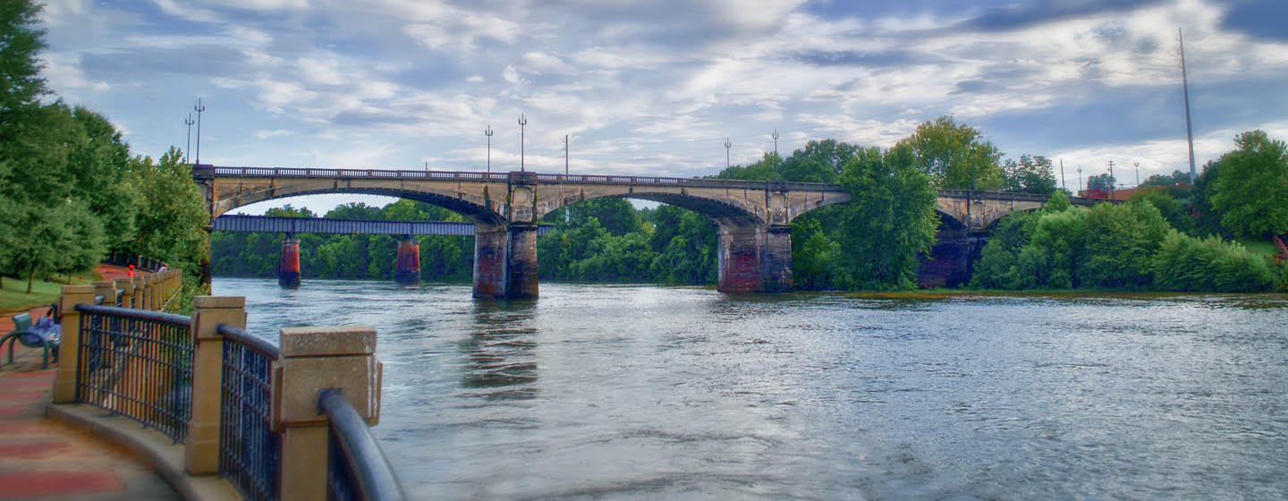 Concrete bridge over river with trees in Columbus, Ohio