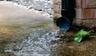 Water coming out of downspout and pooling onto concrete