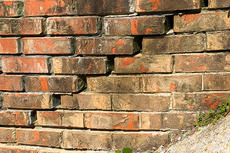 cracking brick wall exterior
