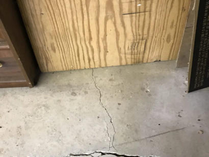 small and medium crack on concrete basement floor