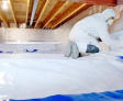 Groundworks expert encapsulates a crawl space in safety gear.
