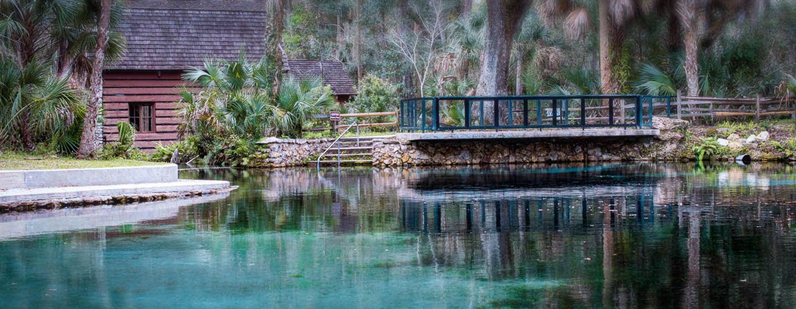 River with log cabin and bridge in Ocala, Florida