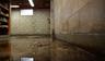 Flooded basement interior with window