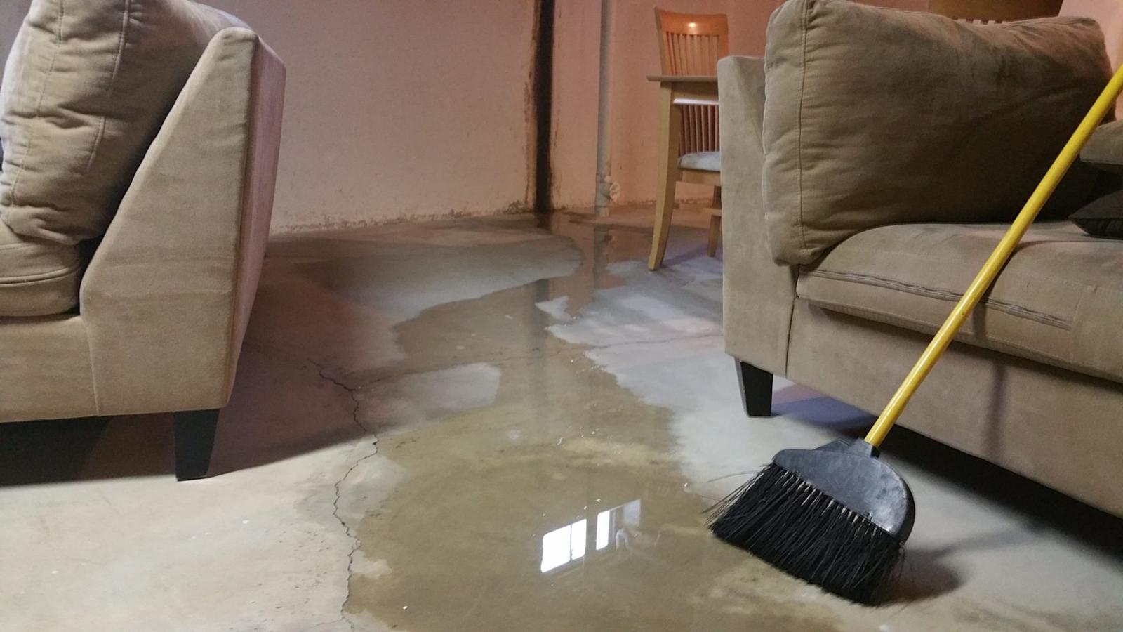 Flooded basement with crack in the floor