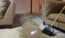 Flooded basement with crack in the floor