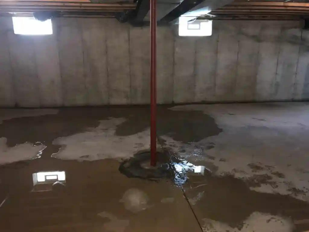Flooding interior basement with water intrusion from the floor.