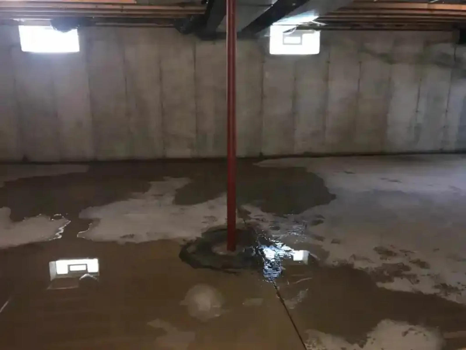Flooding interior basement with water intrusion from the floor.