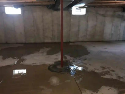 Flooding interior basement with water intrusion from the floor.