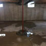 Flooding interior basement with water intrusion from the floor.