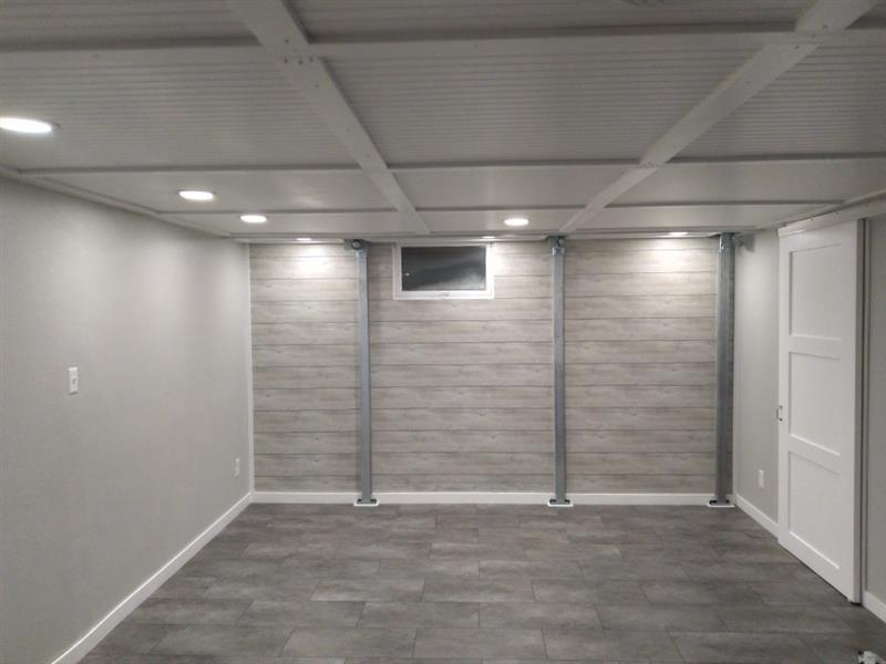 Minimalist room with gray walls, a small window, recessed lighting, and tiled floor.