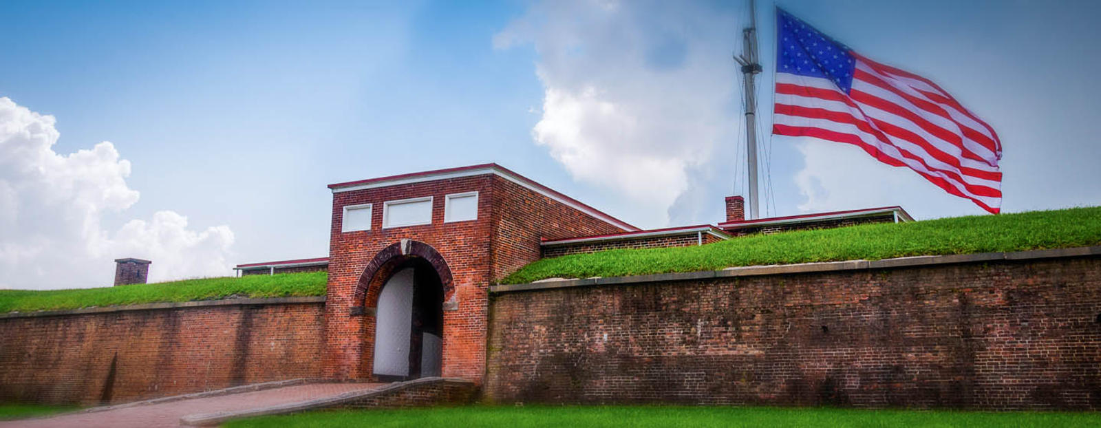 Brick tunnel with flag in Baltimore