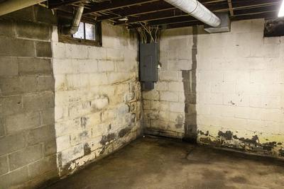 Wet basement walls with pooling water