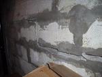 Close up of cracking and bowing concrete basement wall