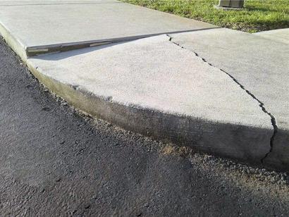 Cracked concrete sidewalk