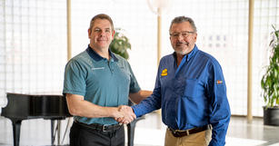 Matt Malone and Ted Munkrees handshake