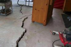 Extreme cracked slab floor in basement