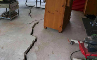 Extreme cracked slab floor in basement