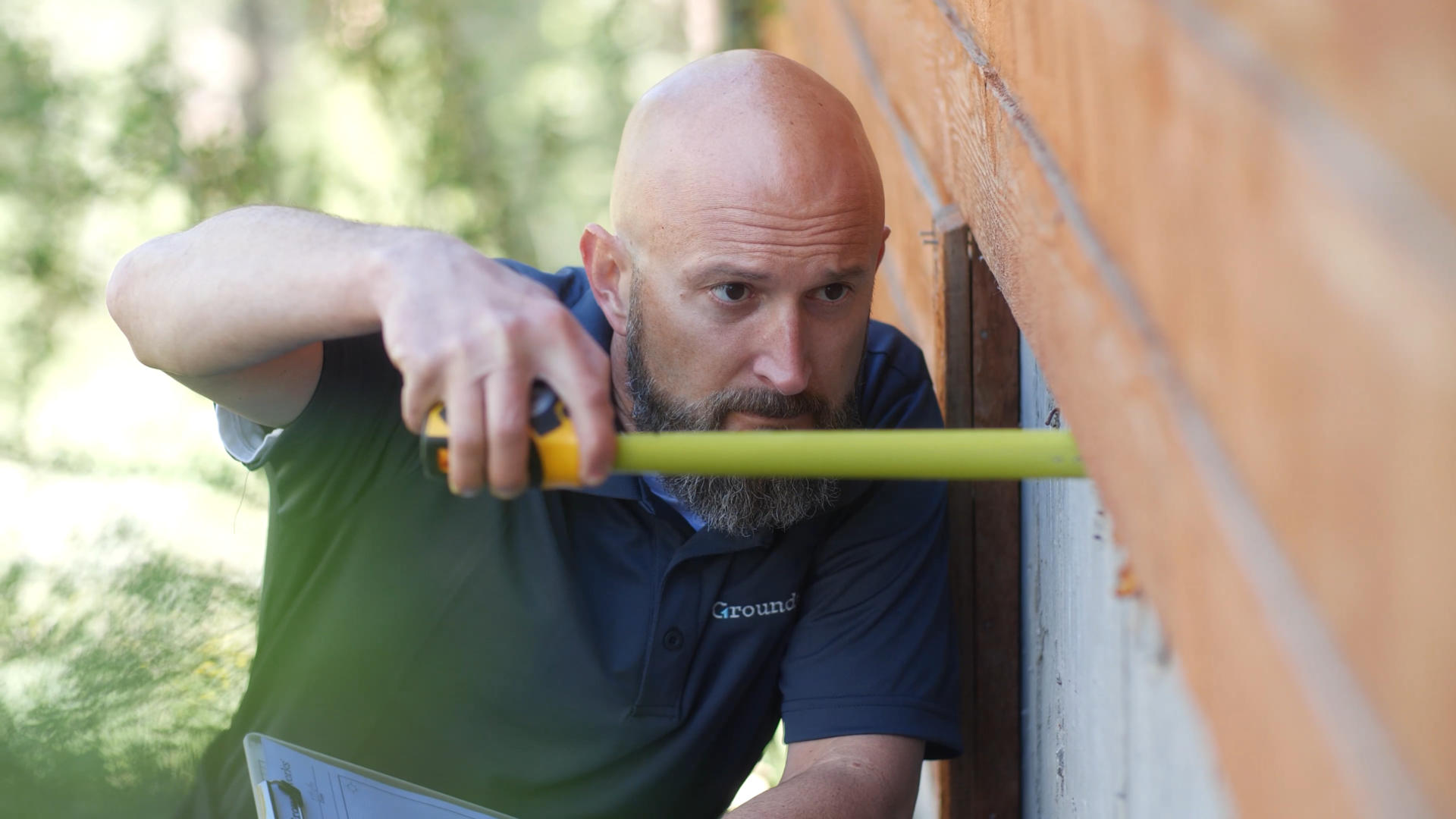 Groundworks Certified Field Inspector with tape measure