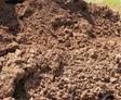 Crumbled loose soil in pile