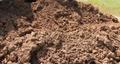 Crumbled loose soil in pile