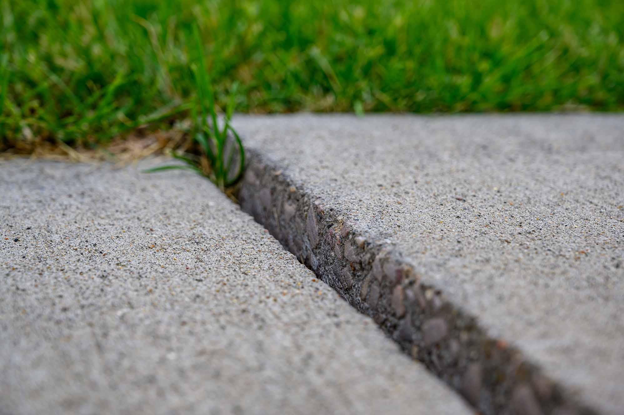 cracked concrete sidewalk