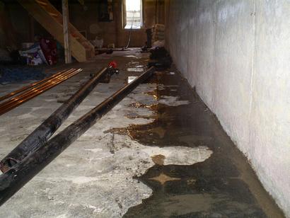 Water seeping through cove joint in basement