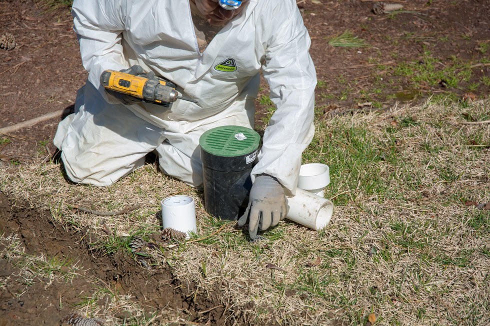 Worker installing a yardwell